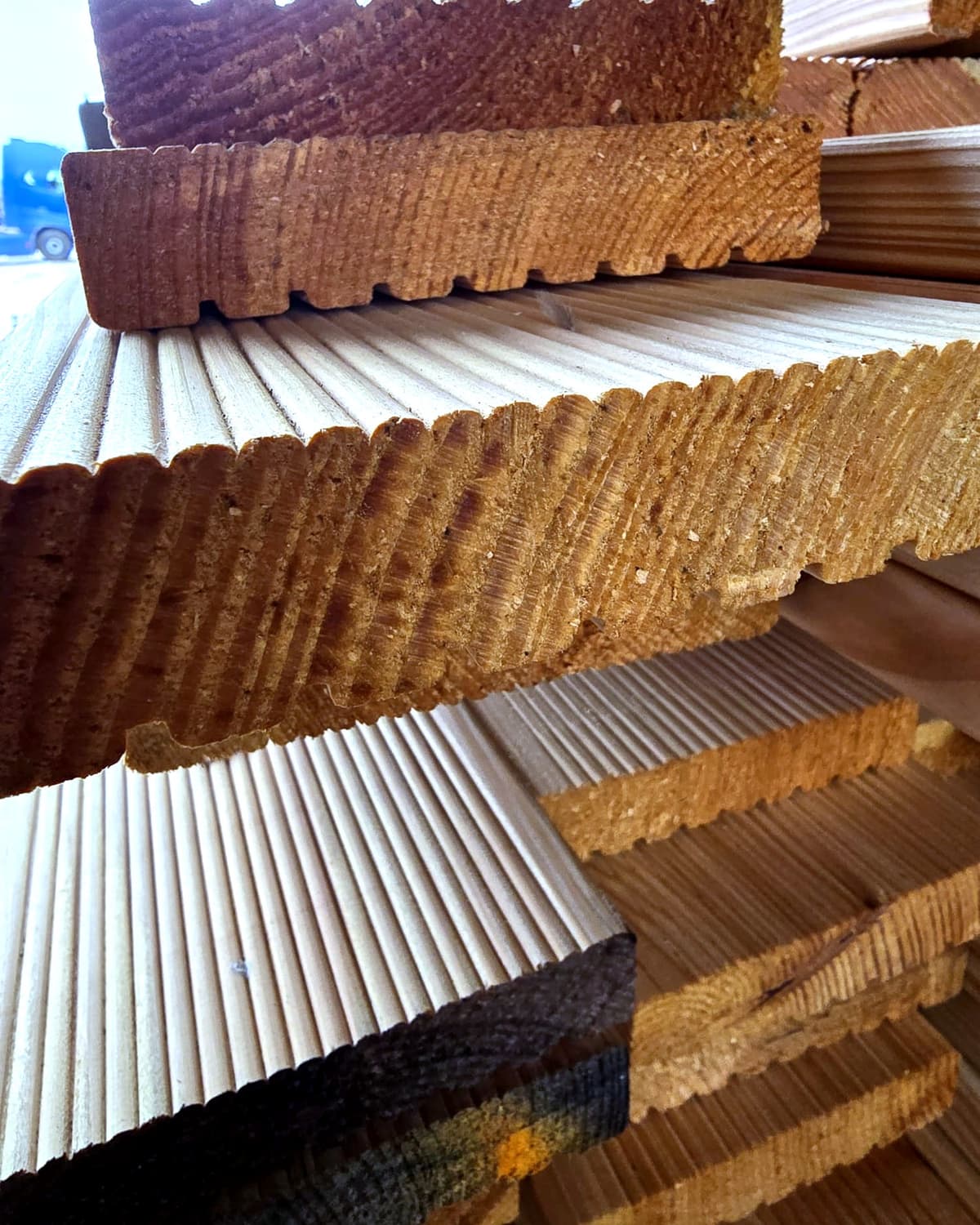 Grooved decking boards in different finishes