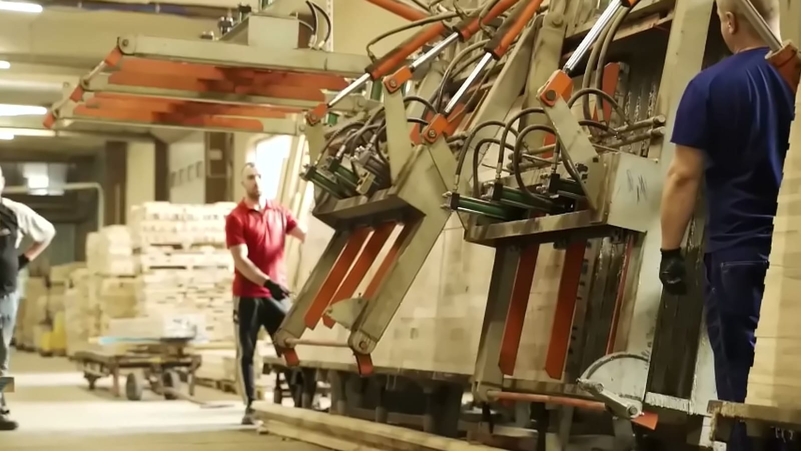 Sawmill team working at the glulam press